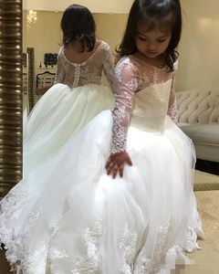 フラワーホワイトガールズドレス長袖イリュージョンレースアップリケカバーボタンシアーネックカスタムメイドリトルガールページェントボールガウン