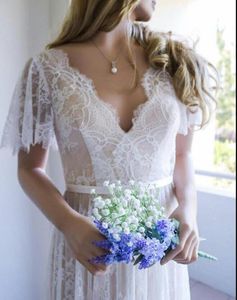 Vinatge Pizzo spiaggia Abiti da sposa senza schienale nudo A-line scollo a V senza schienale maniche corte Abiti da sposa applique Abito lungo da sposa boheme