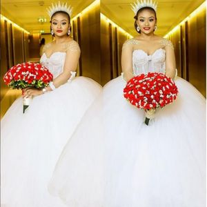 Afrykańskie suknie ślubne Sheer Jewel Neck luksusowe zroszony suknie balowe z frędzlami suknie ślubne z długim rękawem seksowny tył suknie ślubne w dużych rozmiarach