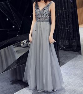 Fantastiska kvällsklänningar Lång Silver Grå Sexig V-Neck Ärmlös Backless Long Prom Klänningar Shinihng Pärlor med Sequins