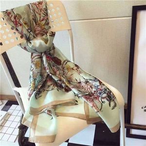 Scialle stampato monocolore da donna alla moda ed elegante e scialle abbronzante da spiaggia da donna estiva in stile design a tre colori