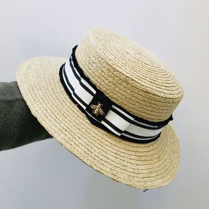 Mode designer gräs halm kepsar sommar platt vintage söt bee elegant svart vit element stingy brim hattar för kvinna damer