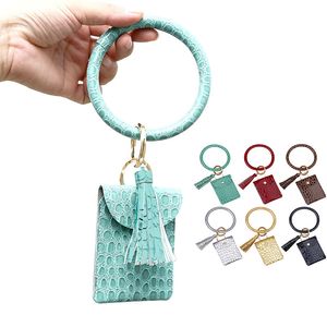 Hot Selling Stor Circle Key Ring Armband Monogrammed Leather Wristlet Keychain Armband Bangle Keyring Holder med Mini Väskor