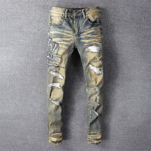 Jeans da uomo Consegna gratuita 2021 Pantaloni elasticizzati patchwork in pelle PU con pantaloni skinny retrò ricamati a forma di serpente