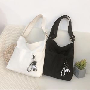 White Black Canvas Shoulder Bag Cute Puppy Pandent Accessory Cross Body Bag Solid Girls Messenger Bag Students Package Bags Handbag M073