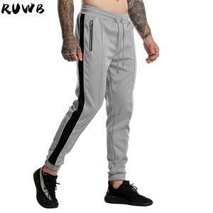 Casual sport byxor män joggare streetwear hip hop sweatpants fitness män sportkläder spår byxor stripe gym jogging byxor män