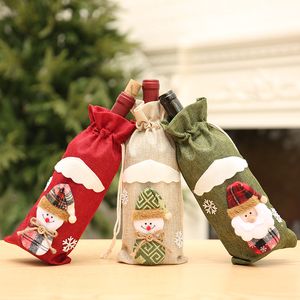 Julröd vinflaska täcker snögubbe älg vin flaska väska bord juldekorationer