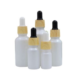 Tom Pearl Vit Glasflaska Falskt träplast Lid Kosmetisk Förpackning Essentiell Olja Gummi Dropper Refillerbara flaskor Behållare 5 ml 10 ml 15 ml 30 ml 50 ml