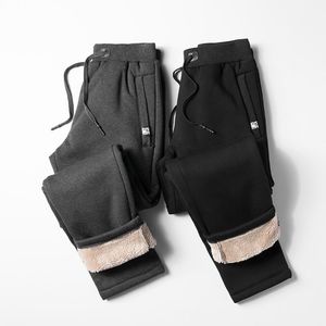 Mäns byxor förtjockar Sweatpants Vintern Män mode sammet vadderade byxor stor storlek super varm trend sport jogges l-8xl1