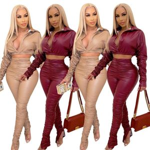 Tute da donna 2021 Autunno Inverno Trendy Women PU Leather Two Pieces Set Sexy Deep V-Neck Manica a pieghe Crop Top Vita alta Drappeggiato Si