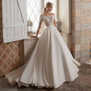 Ivory Lace Long Sleeves Wedding Dresses Sheer Bateau Neck A Line Sequined Bridal Gowns Plus Size Sweep Train Satin robe de mariée