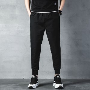 Esporte Running Sweatpants Bolsos Treinamento e Jognings Track Fitness Calças para Homens Pantalones Hombre LJ201103