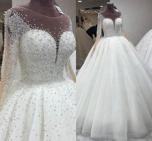 Lyxiga kristaller Sequins Beaded Ball Gown Bröllopsklänningar med Illusion Långärmad Sheer Neck Brudklänningar 2021 Puffy Vestidos Al7217
