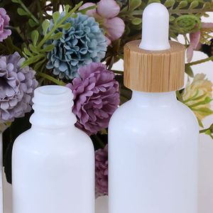Leere weiße Porzellan-Tropfflaschenfläschchen 10 ml, 15 ml, 20 ml, 30 ml, 50 ml, 100 ml mit Bambusdeckel für ätherische Öle, Kosmetikverpackungen