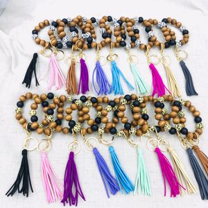 Personalized handmade wholesale stretched Leopard Wood Beaded Keyring trendy popular large wooden beads tassel elastic braceletkeychains