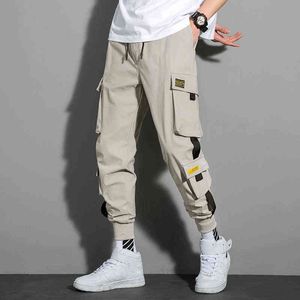 Casual Mężczyzna Przycięte Spodnie Wstążki Harem Joggers Mężczyźni Cargo Spodnie Nastolatki Streetwear Hip Hop Casual Kieszenie Spodnie Moda Clothi G220224