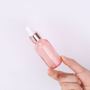 Garrafa de perfume essencial de óleo de vidro personalizado 5ml 10ml 15ml 20ml 30ml 50ml 100ml transparente garrafas de soro de ouro rosa com conta -gotas