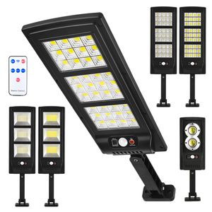 Luzes solares do diodo emissor de luz exterior 3 modos Sensor de movimento Spotlights solares com lâmpadas de parede impermeáveis ​​do controle remoto para a decoração do jardim