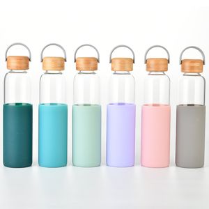Garrafas de água de vidro de borossilicato de 600ml com manga de silicone antiderrapante Esportes Garrafa de água de ioga
