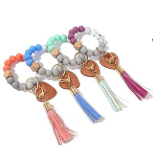 Favorit Silikonpärlor Armband Keychain Trä Beaded Key Ring Love Wood Chip Bangle Keyring Decor Suede Tassel Bil Pendant RRF13456