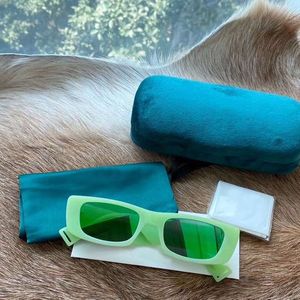 Fluorescencyjne neonowe zielone owalne szczupłe okulary przeciwsłoneczne dla kobiet mężczyzn 0517 des lunettes de soleil 52 mm unisex moda okulary przeciwsłoneczne Uv400 producent z pudełkiem