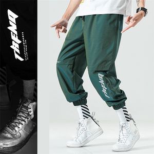 Sweatpants عاكس الرجال 2020 جديد أزياء الهيب هوب الفضفاضة السراويل الرجال عالية الشارع ركض السراويل الذكور مرونة الخصر الحريم السراويل LJ201104