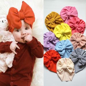 Caps Hats 30 шт. / Лот Твердые Seersucker Baby Hat Waffle Fabric Big Bow Beamies Topknot Turban Bonnet Headwear для 0-5T Kids1