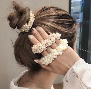 女性のエレガントな真珠の髪のネクタイビーズの女の子のザッカーのゴムバンドPonytail Holdersヘアアクセサリー柔らかい弾性のあるヘアバンド締め付け