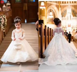 2022 Adorabile abito da ballo bianco Abiti da ragazza di fiori Principessa Sheer maniche lunghe Appliques Gioiello Collo Abiti da festa di compleanno per bambini DWJ0128