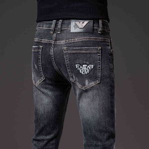 a Brand Autumn and Winter Slim Fit Jeans Men's Elastic Slim Fit Small Foot Printing Trend Jeans Washed