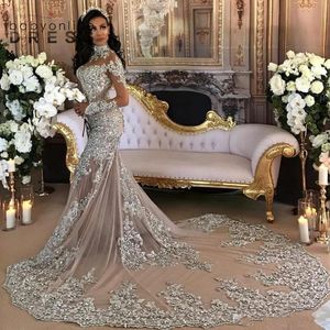 Dhl dubai arabiska lyxiga bröllopsklänningar sexiga bling pärlspets applikation hög hals illusion långa ärmar sjöjungfrun kapell brudklänningar