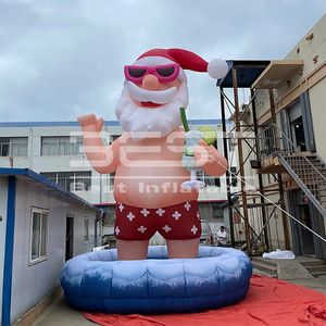 25ft Customized Giant Inflatable Santa With Swimming Ring For Advertising