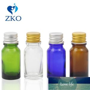 5ml 10ml 15ml 20ml 30ml 50ml Botellas de vidrio de agua de maquillaje transparente con tapa de aluminio plateado / dorado Frascos de almacenamiento de botellas de líquido portátiles Precio de fábrica diseño experto