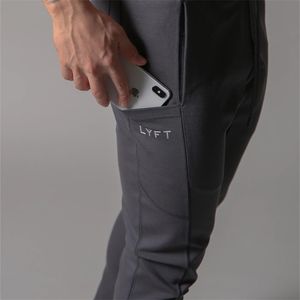 Mäns Sport Gym Slim Fitness Jogging Byxor Mäns Casual Penna Byxor Ren Bomull Fashion Skinny Foot Zipper Sweatpants 211108