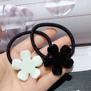 Fashion black and white acrylic flower rubber bands head rope hair ring hairpins popular headwear jewelry in European and American countries