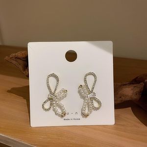 Stud Koreanische Mode frauen Einfache Strass Imitation Perle Bowknot Ohrringe Temperament Weiblichen Schmuck Zubehör