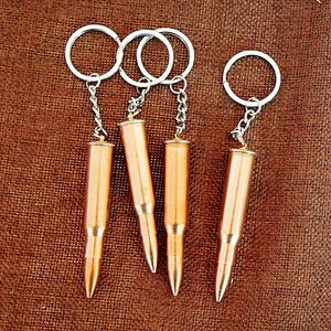 Bullet Key Chain Party Favor Mężczyźni Chłopcy Projektant Moda Metal Symulacja Shell Pistolet Zbiornik Samolot Hammer Bell Ear Pick Brelovenir