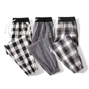 Pantaloni Harem scozzesi a righe da uomo Pantaloni casual Pantaloni estivi da uomo Harajuku con coulisse allentata Pantaloni selvaggi da uomo Pantaloni da jogging hip-hop 211112