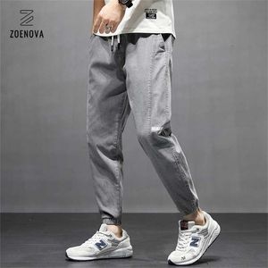 Streetwear hip hop cargo byxor män imitera jeans lastbyxor elastiska harun byxor joggare grå byxor på vår och sommar 211108