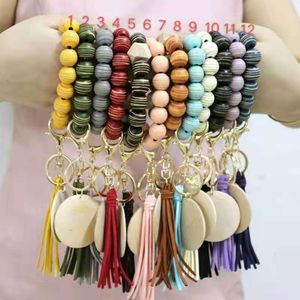 Cross-border personality bracelet craft carved wood beads keychain blank disc tassel key ring pendant multi-color optional factory wholesale