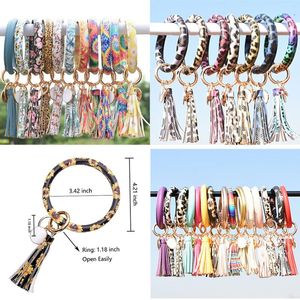 Moda Donna Nappe Bracciali Bracciale PU Pelle Avvolgente per feste Portachiavi Leopardo Stampa giglio Portachiavi Polsino Girasole Gocciolamento Olio Cerchio Chiavi Catene da polso