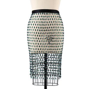 スカートセクシーなラインストーン女性ミディスカート光沢のあるフェイクダイヤモンドクリスタル中空アウトグリーンビーズ包帯