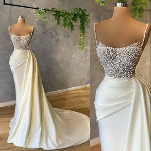 2021 Sexy Arabic Mermaid White Evening Dresses Wear Spaghetti Straps Sleevelesss Crystal Beads Pearls Satin Formal Prom Gowns Party Gowns Sweep Train