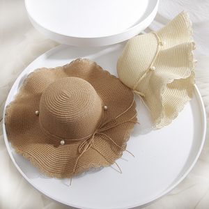 Female Summer Wave Wavy Edge Straw Hat Along Pearl Bow Big Along Hat Korean Travel Beach Sunscreen Hat Wholesale