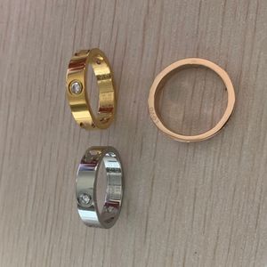 Never fade 316L titan stål kärleksringar 18K guld rosé guld silver Bröllopsdiamant Ring för män kvinnor förlovning manlig kvinnlig allians