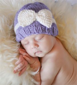 Neonato inverno inverno caldo croceht cappello arco carino fatto a mano a maglia a maglia orecchio muff bambino maglia cappelli bowknot cappelli kbh34