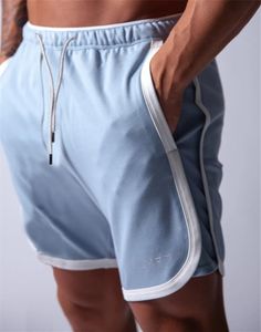 Pantaloncini da corsa 2021 Sport da uomo Maglia ad asciugatura rapida Allenamento attivo Esercizio da jogging 2 IN 1 Con fodera più lunga 4 colori