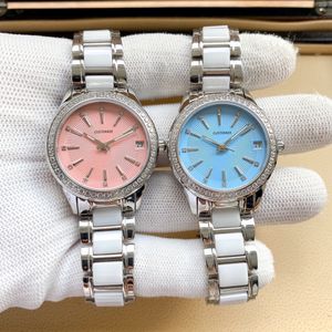 カジュアルな女性の幾何学的な自動機械的日時計銀のステンレス鋼白いセラミックの腕時計ピンクの青いダイヤル時計