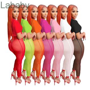 2022 Два куска наборы прозрачные сетки йоги брюки для женщин дизайнер одежда с короткими рукавами леггинсы свита сексуальный спортивный костюм