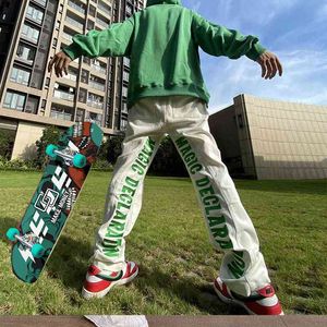 Jeans vår och autuprinted brev y2k jeans lösa hip hop byxor skateboarding byxor pojkvän män kvinnor